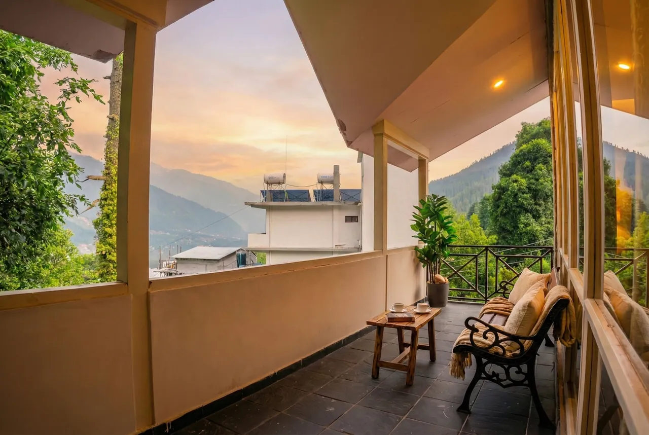 View of Himalayan peaks from a balcony in Manali across all seasons